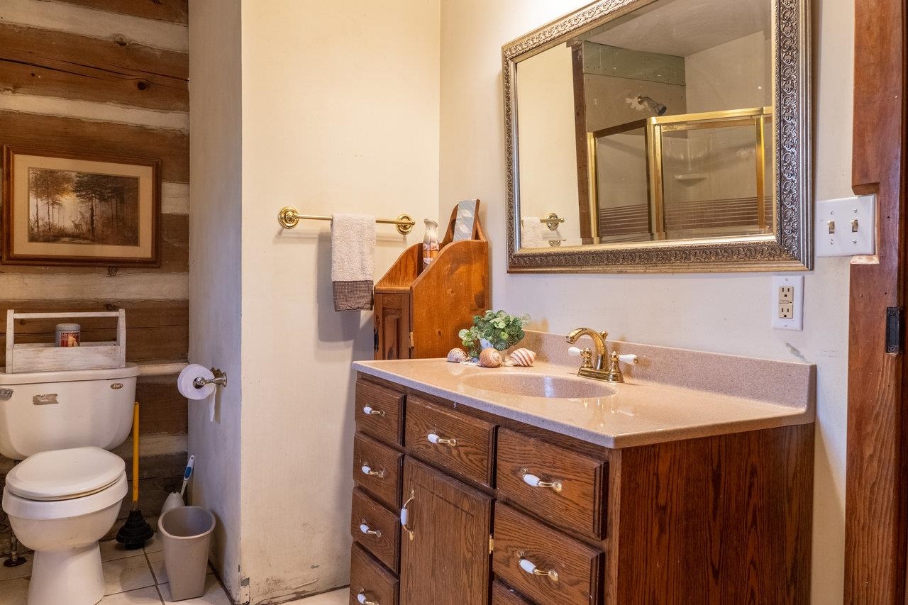 800 Cove Mountain Road Mathias, WV 26812 - Photo 26 of 74 a bathroom with a sink vanity mirror and toilet