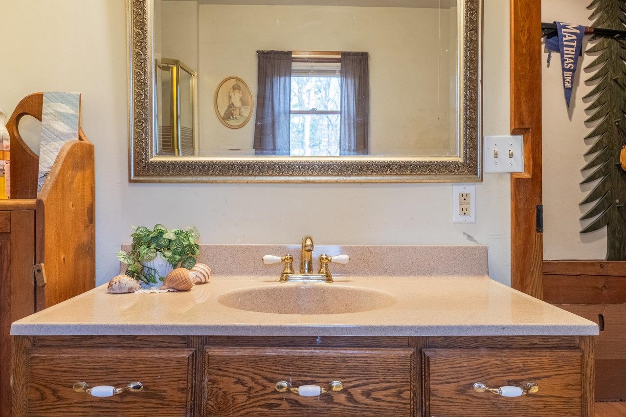 800 Cove Mountain Road Mathias, WV 26812 - Photo 27 of 74 a bathroom with a sink and a mirror