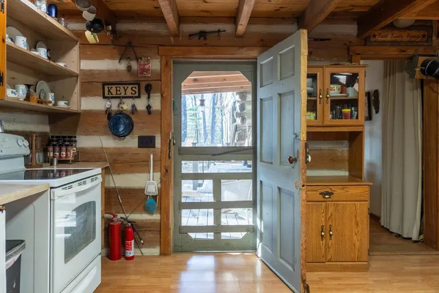 a view of storage and utility room with washer and dryer