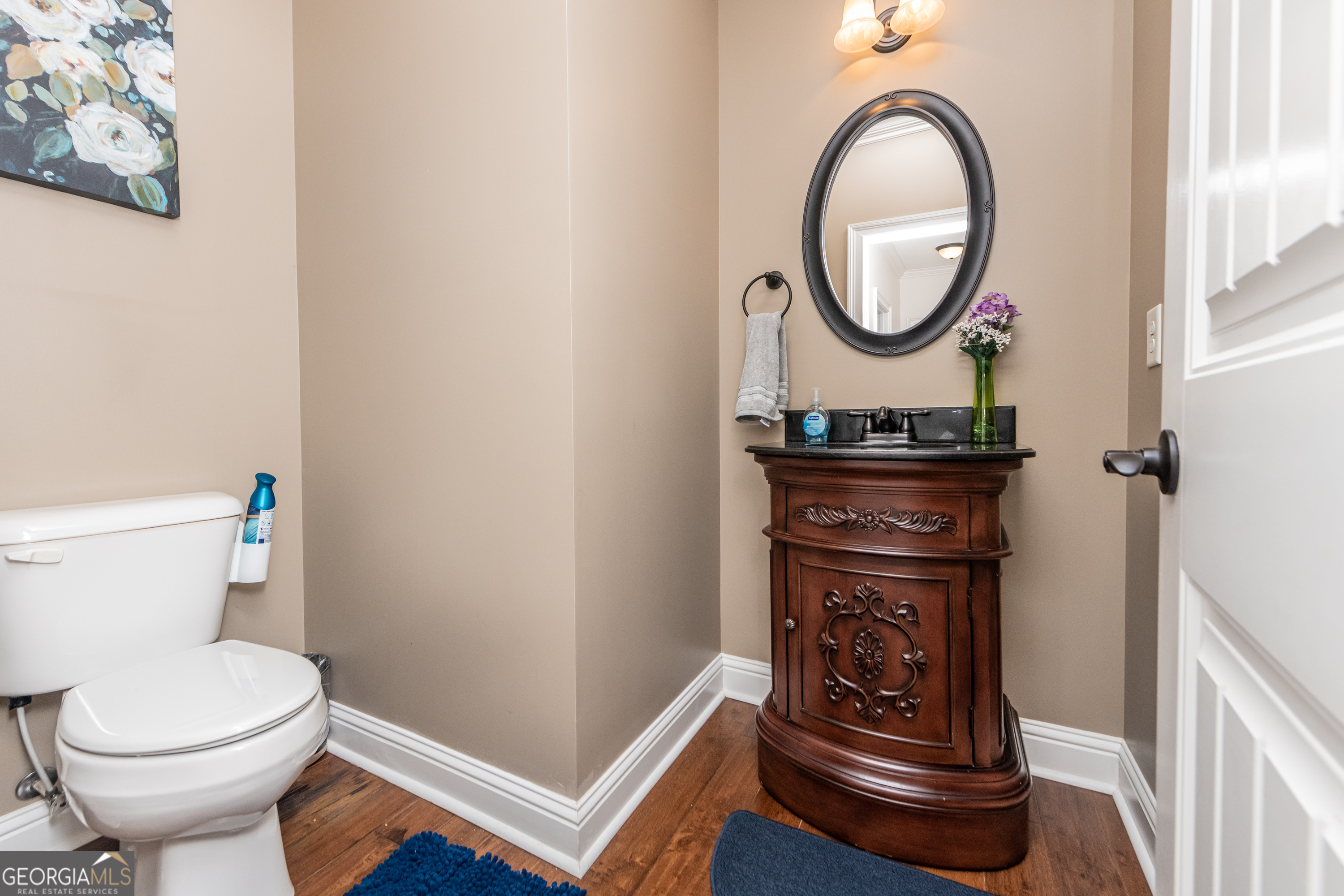 405 Old Bridge Road Warner Robins, GA 31088 - Photo 27 of 55 a bathroom with a toilet a sink and a mirror