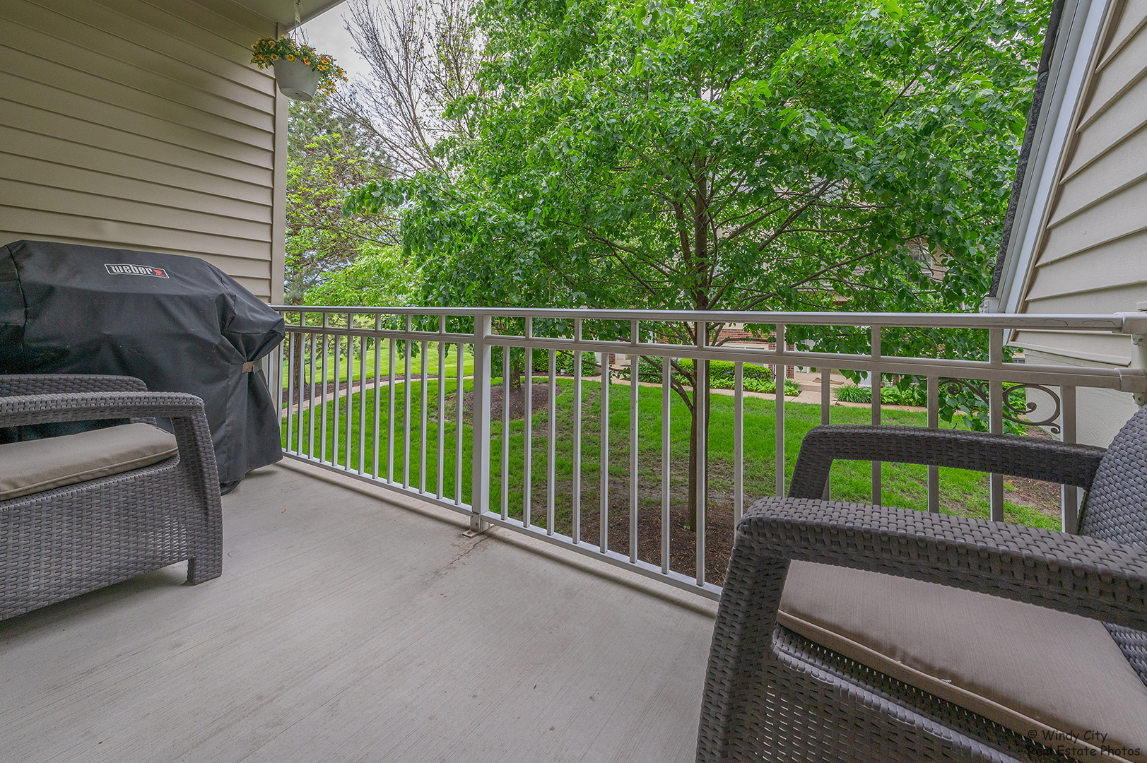 645 Pheasant Trail St. Charles, IL 60174 - Photo 17 of 18 a view of a deck with two chairs and a potted plant