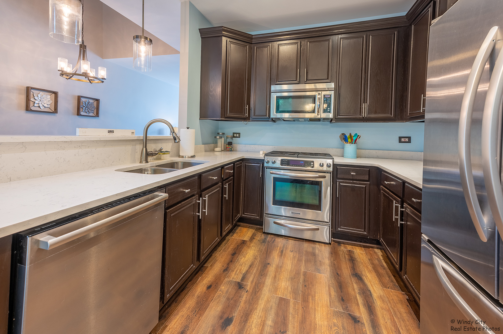 645 Pheasant Trail St. Charles, IL 60174 - Photo 3 of 18 a kitchen with stainless steel appliances granite countertop a sink stove and microwave