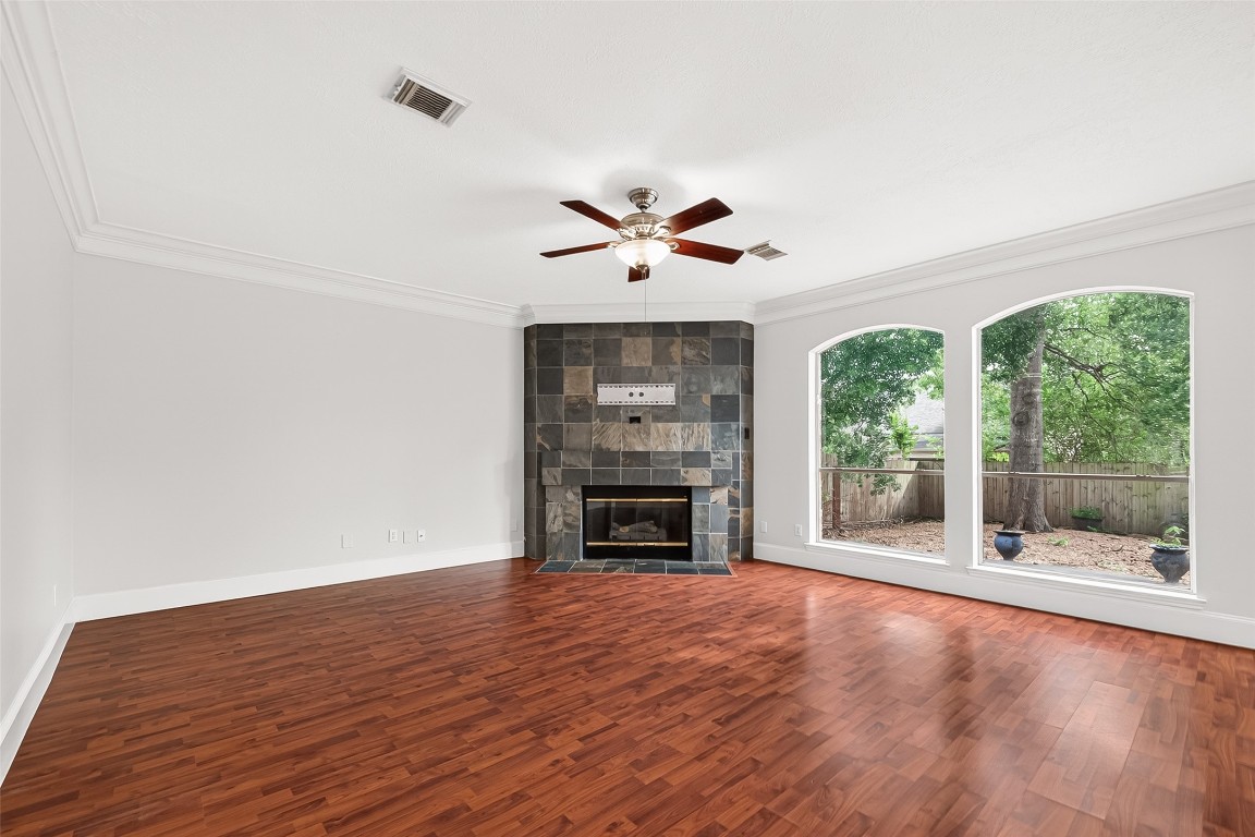 23206 Kobi Park Court Spring, TX 77373 - Photo 11 of 46 Living area with large windows and cozy fireplace.