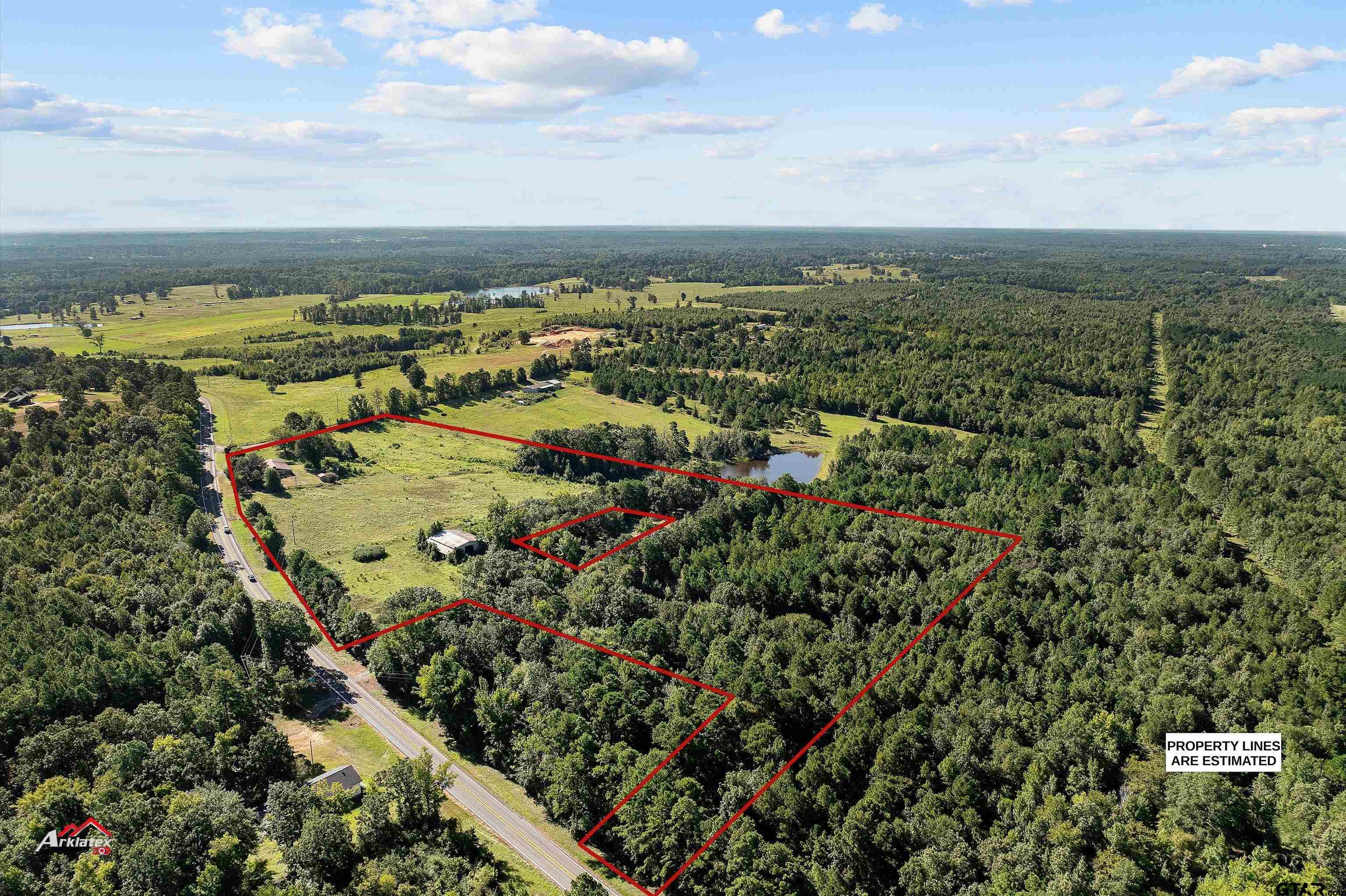 6973 FM 449 Marshall, TX 75670 - Photo 22 of 29 an aerial view of residential houses with outdoor space