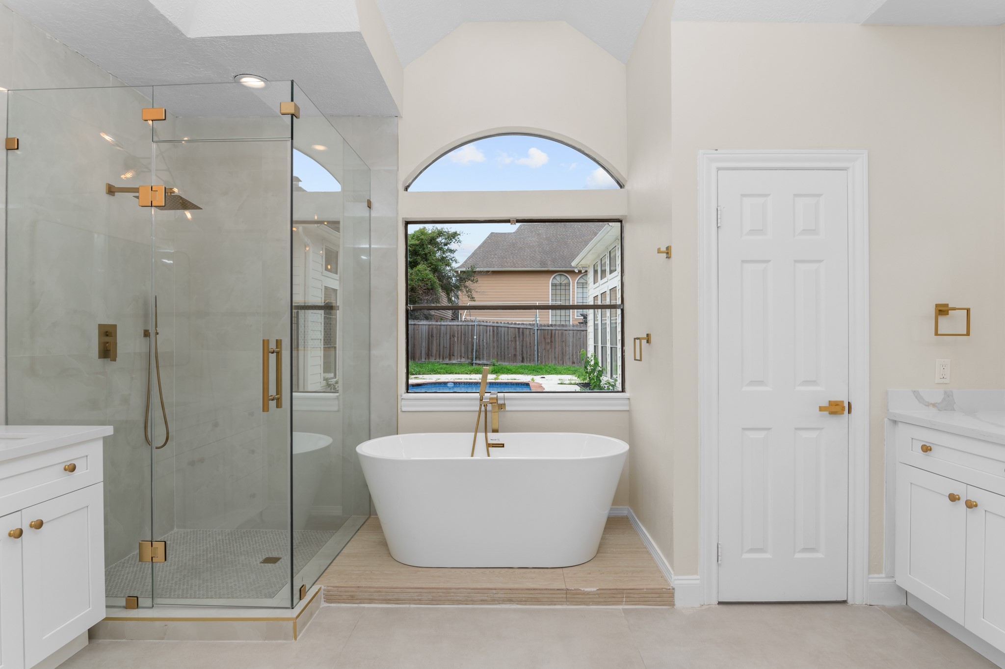 17402 Wilton Park Court Spring, TX 77379 - Photo 17 of 50 a white bath tub sitting next to a window