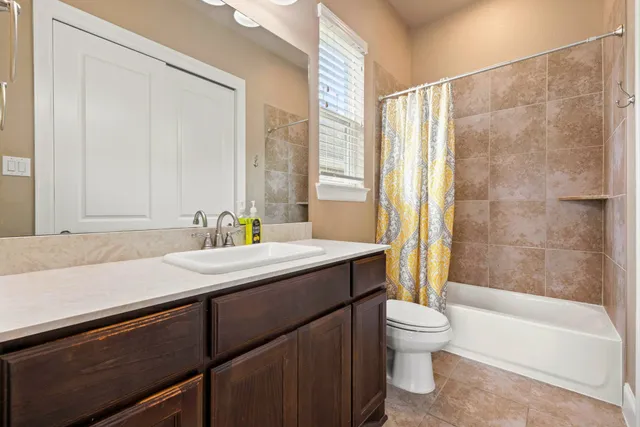 a bathroom with a sink a toilet and a bathtub