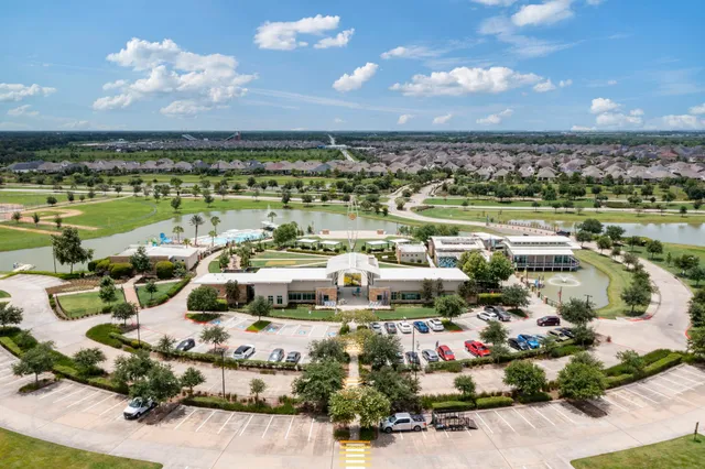 a picture of a city with lots of residential buildings ocean and mountain view