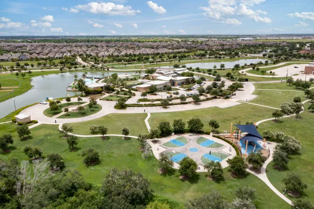 an aerial view of a house with a lake view