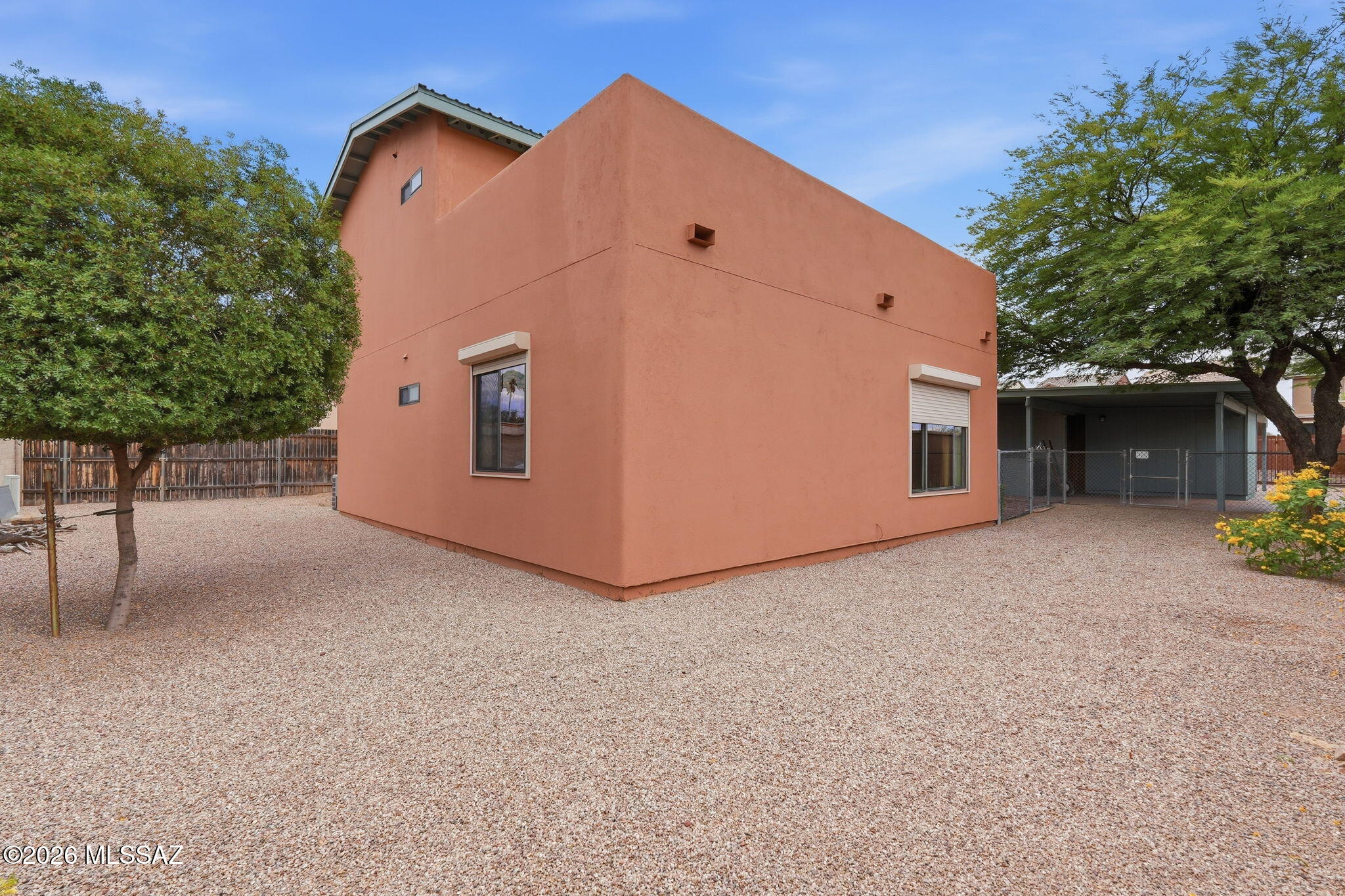 1125 East Kleindale Road Tucson, AZ 85719 - Photo 30 of 49 a view of a house with a yard and garage