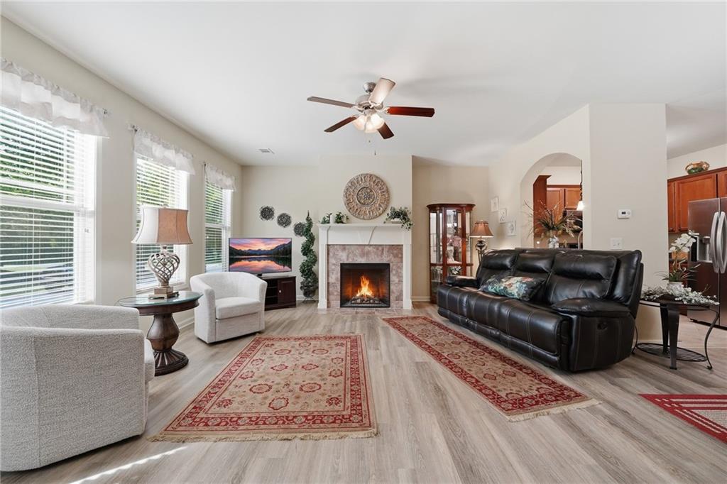 608 Myers Gate Road Ball Ground, GA 30107 - Photo 2 of 31 a living room with furniture and a fireplace