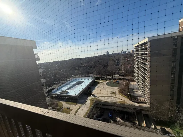 a view of balcony with wooden floor