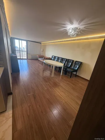 a room with furniture and wooden floor