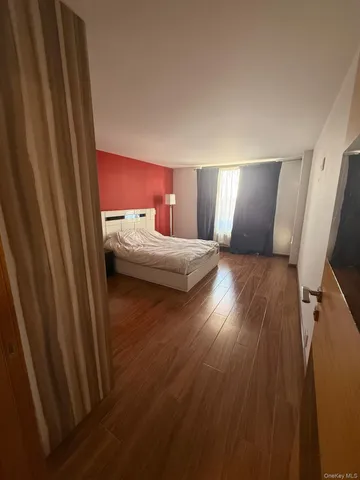 a hallway with wooden floor