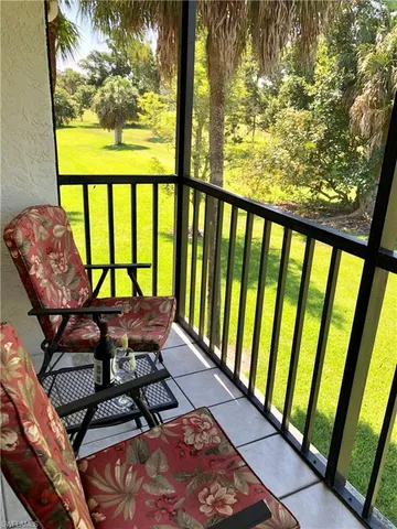 a view of a two chairs in the balcony