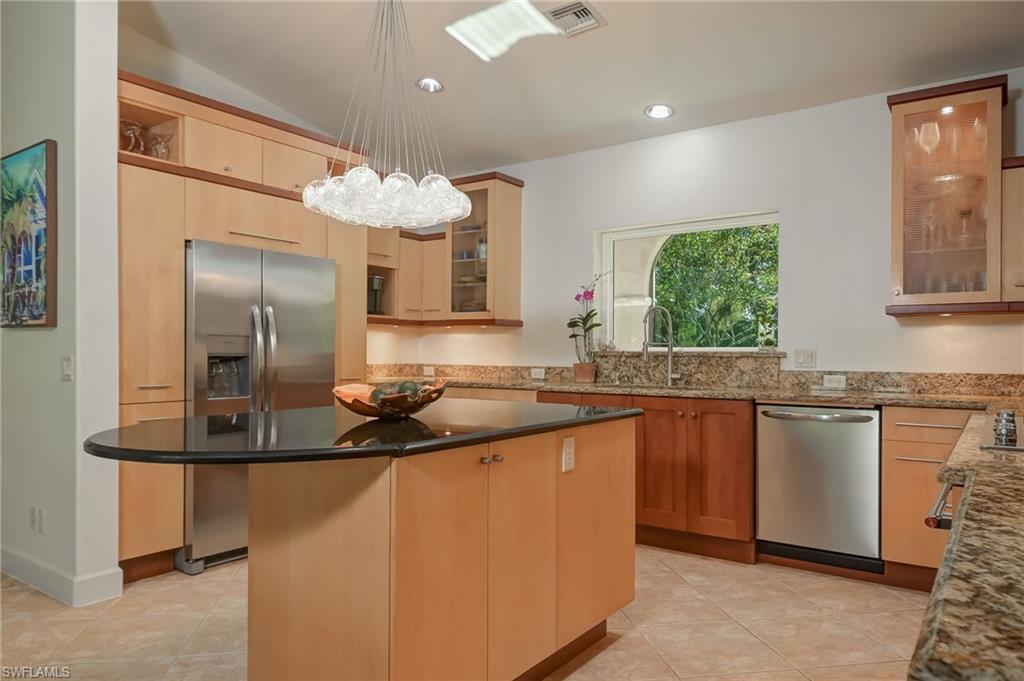 6350 Parkers Hammock Road Naples, FL 34112 - Photo 9 of 49 a kitchen with stainless steel appliances granite countertop a sink and dishwasher