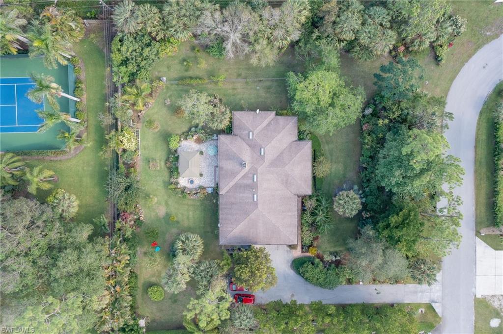 6350 Parkers Hammock Road Naples, FL 34112 - Photo 2 of 49 an aerial view of residential house with outdoor space and trees all around