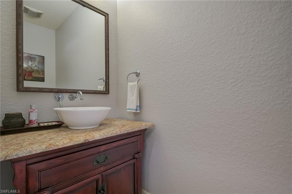 6350 Parkers Hammock Road Naples, FL 34112 - Photo 20 of 49 a sink with a mirror