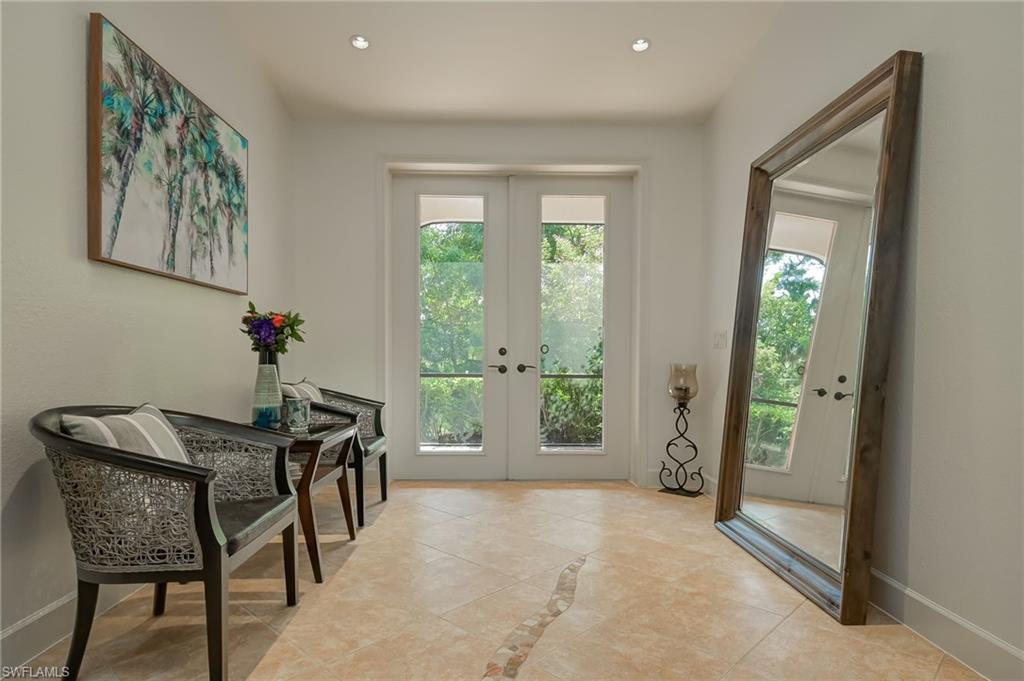 6350 Parkers Hammock Road Naples, FL 34112 - Photo 3 of 49 a dining room with furniture and window