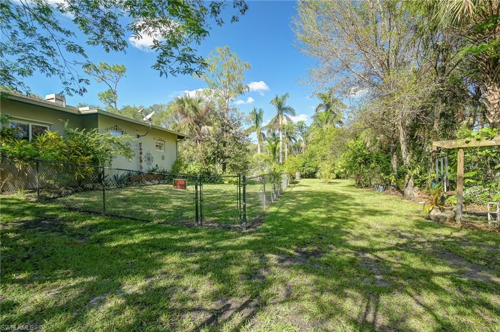 6350 Parkers Hammock Road Naples, FL 34112 - Photo 36 of 49 a view of a garden