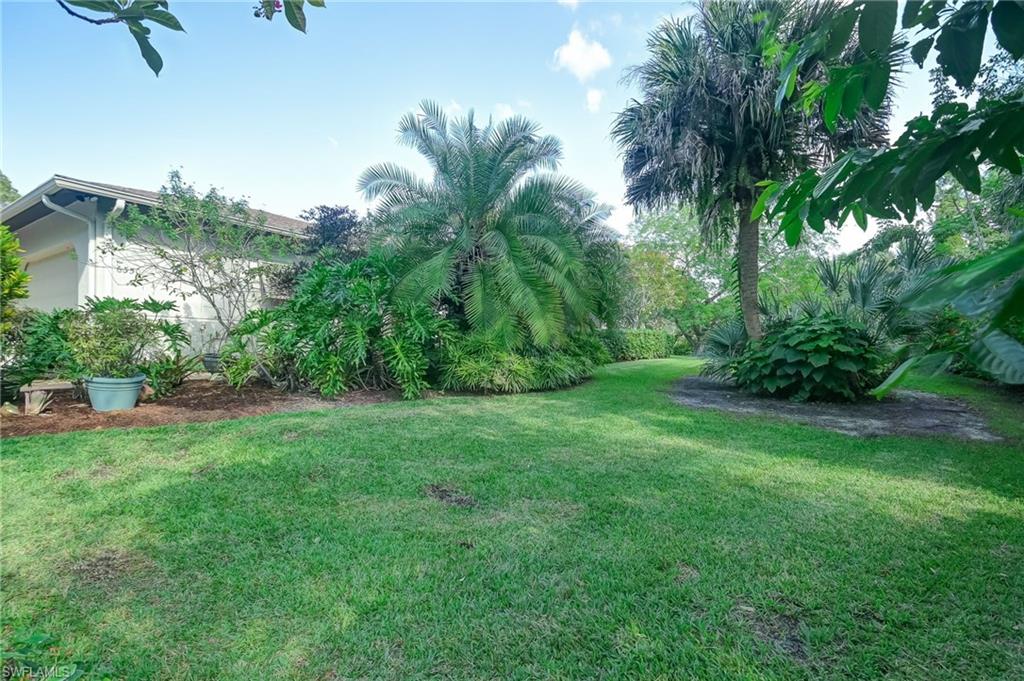 6350 Parkers Hammock Road Naples, FL 34112 - Photo 40 of 49 a view of a lush green space