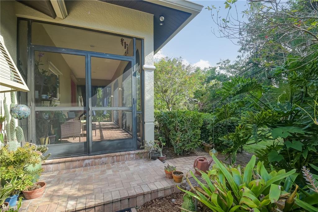 6350 Parkers Hammock Road Naples, FL 34112 - Photo 41 of 49 a view of yard with outdoor seating