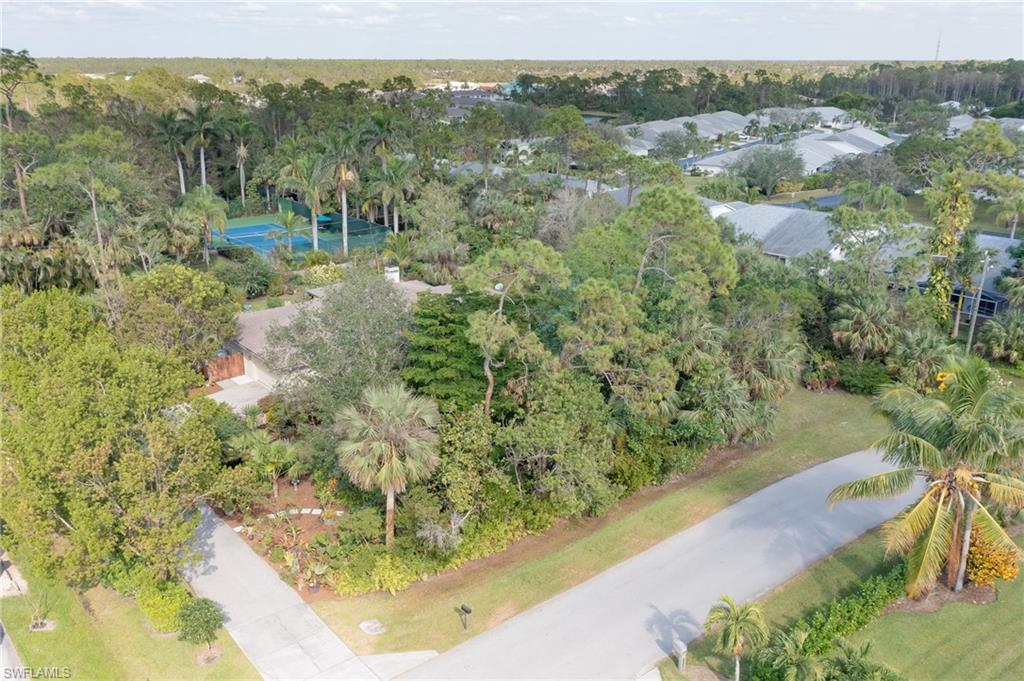 6350 Parkers Hammock Road Naples, FL 34112 - Photo 44 of 49 a view of a forest from a balcony