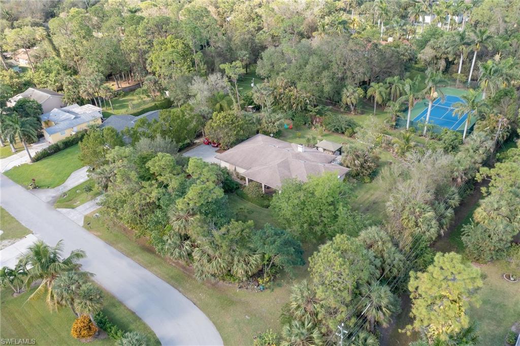 6350 Parkers Hammock Road Naples, FL 34112 - Photo 45 of 49 an aerial view of a house with a yard