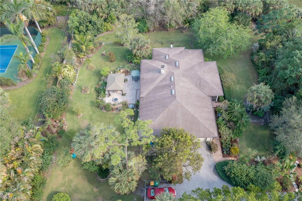 6350 Parkers Hammock Road Naples, FL 34112 - Photo 47 of 49 an aerial view of a house with a yard and garden