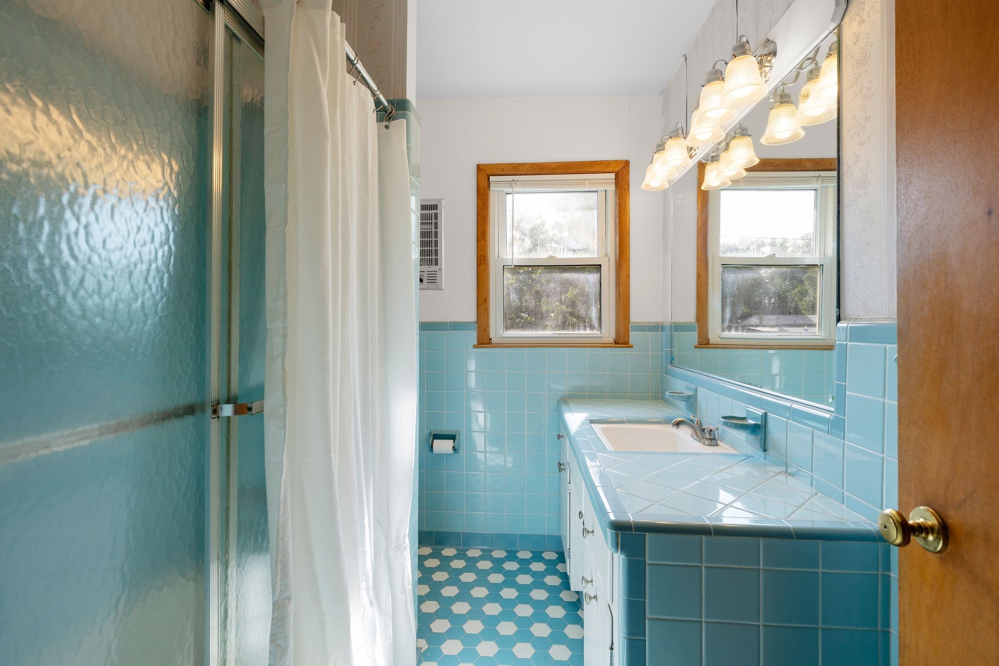 209 Apache Trail Columbia, TN 38401 - Photo 14 of 28 a bathroom with a sink a mirror and a shower