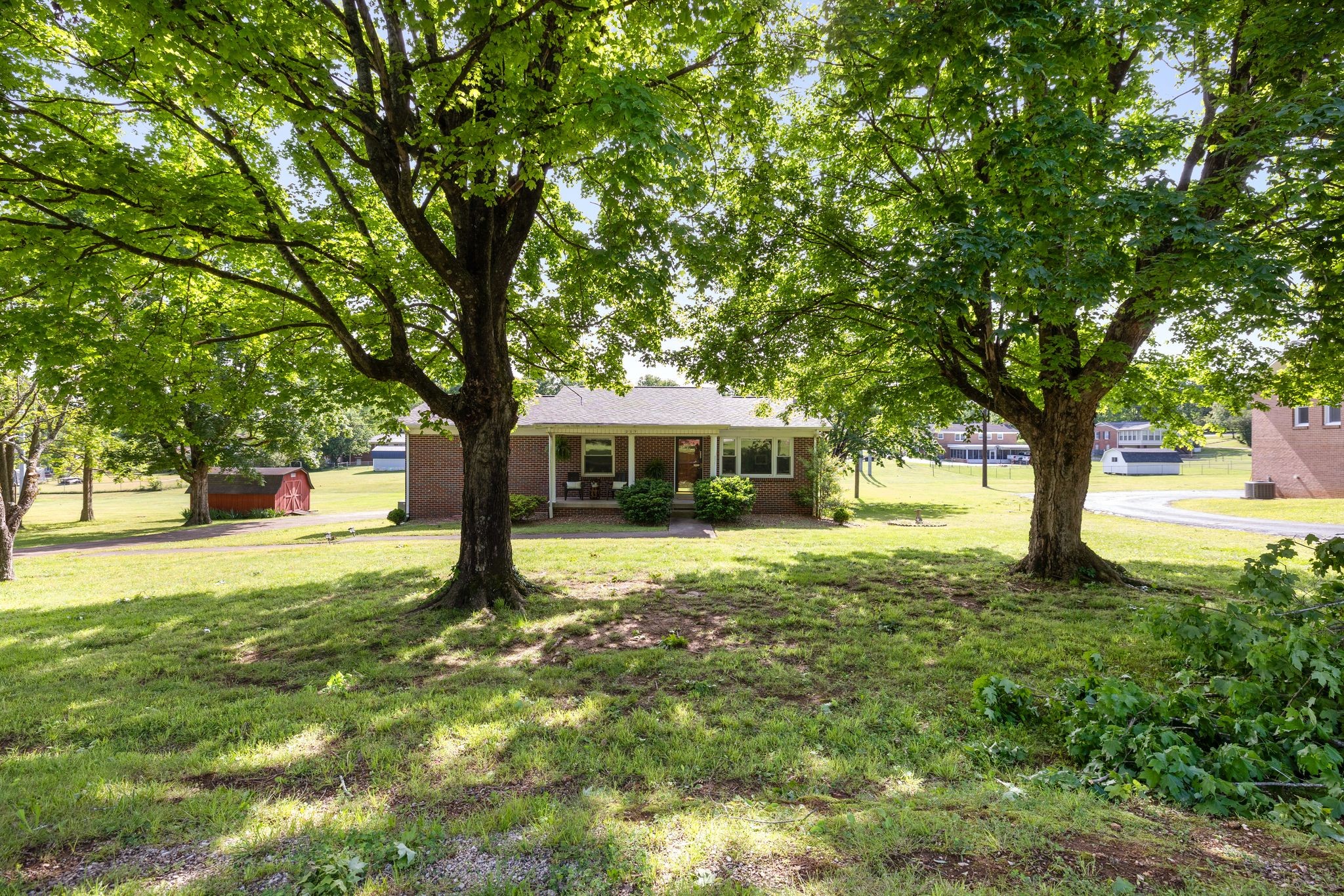 209 Apache Trail Columbia, TN 38401 - Photo 2 of 28 a house with trees in the background