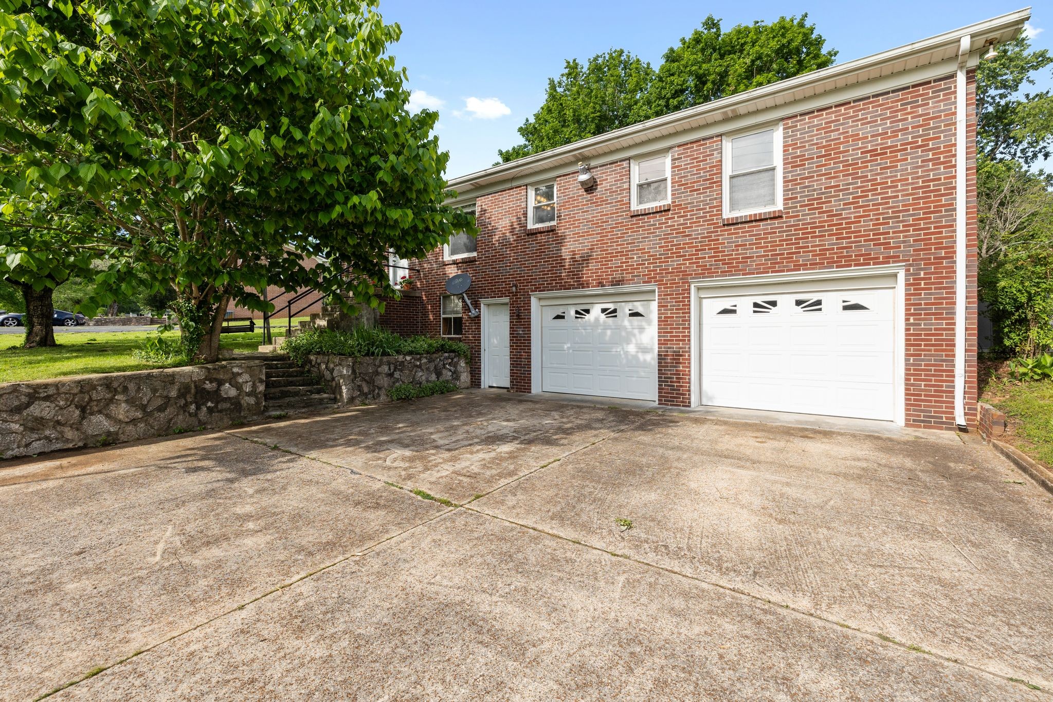 209 Apache Trail Columbia, TN 38401 - Photo 23 of 28 a front view of a house with a yard and garage