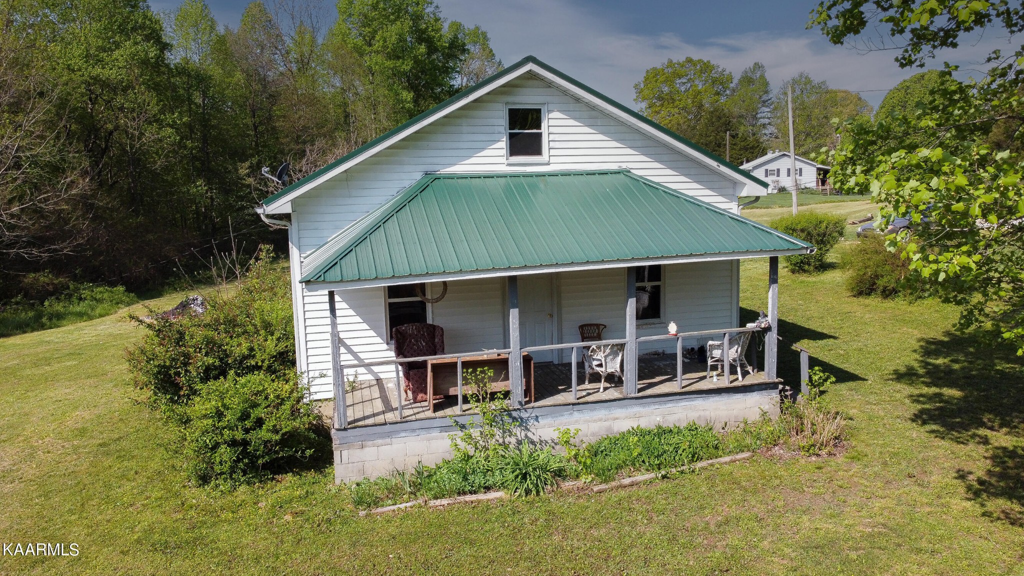 a front view of a house with a yard and balcony