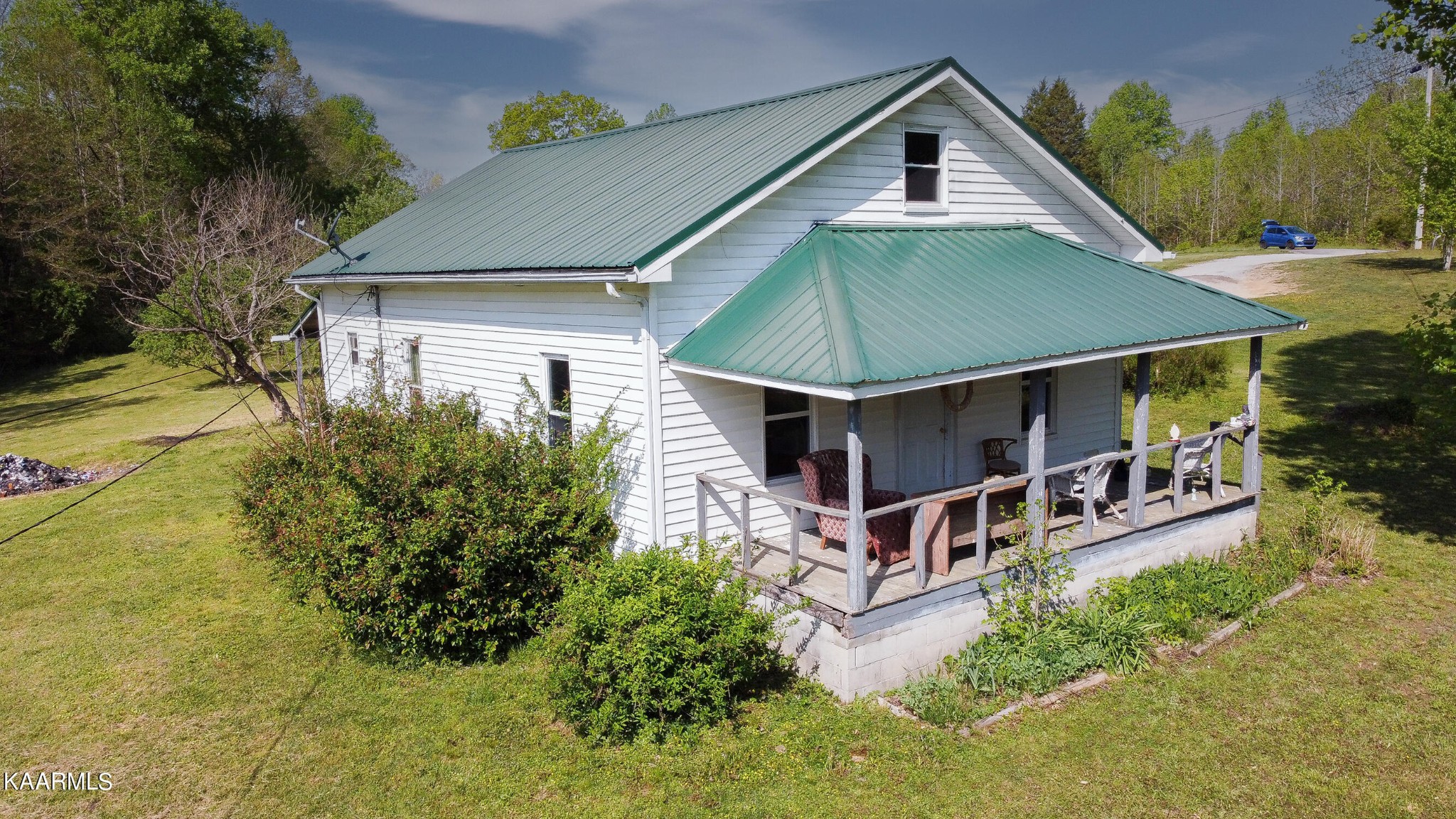 342 Raines Road Wartburg, TN 37887 - Photo 2 of 6 a aerial view of a house with a yard and potted plants