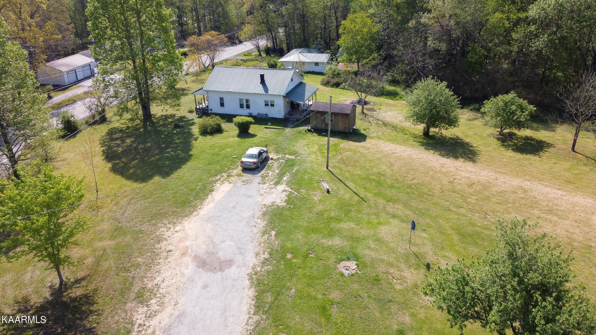 342 Raines Road Wartburg, TN 37887 - Photo 3 of 6 an aerial view of a house with swimming pool and yard