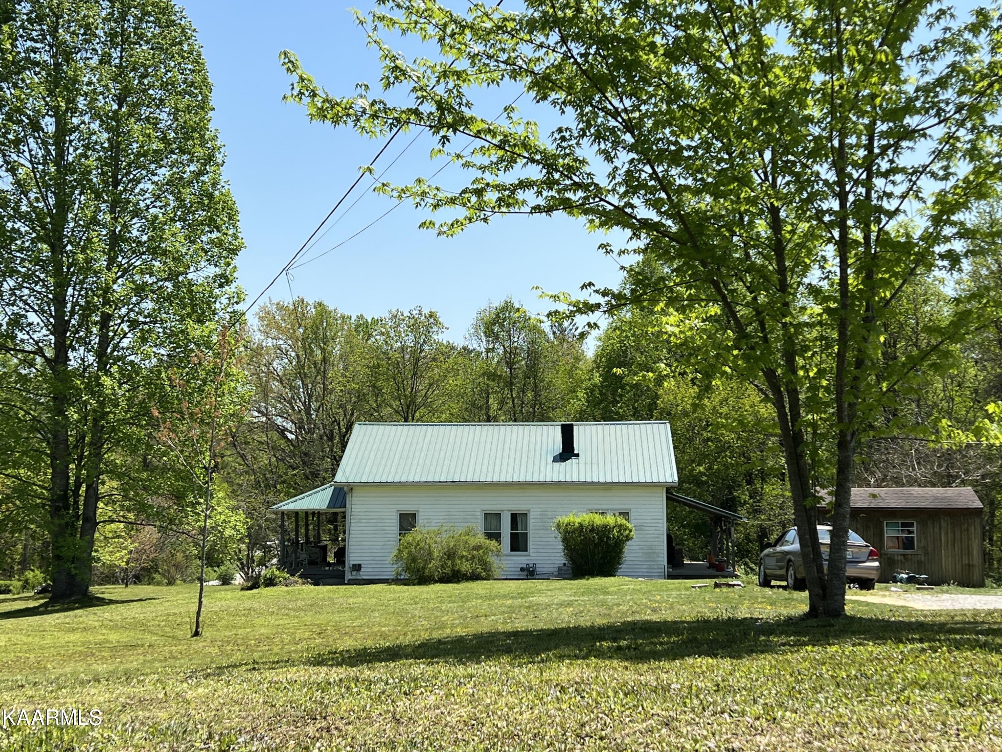 342 Raines Road Wartburg, TN 37887 - Photo 6 of 6 a front view of a house with a yard