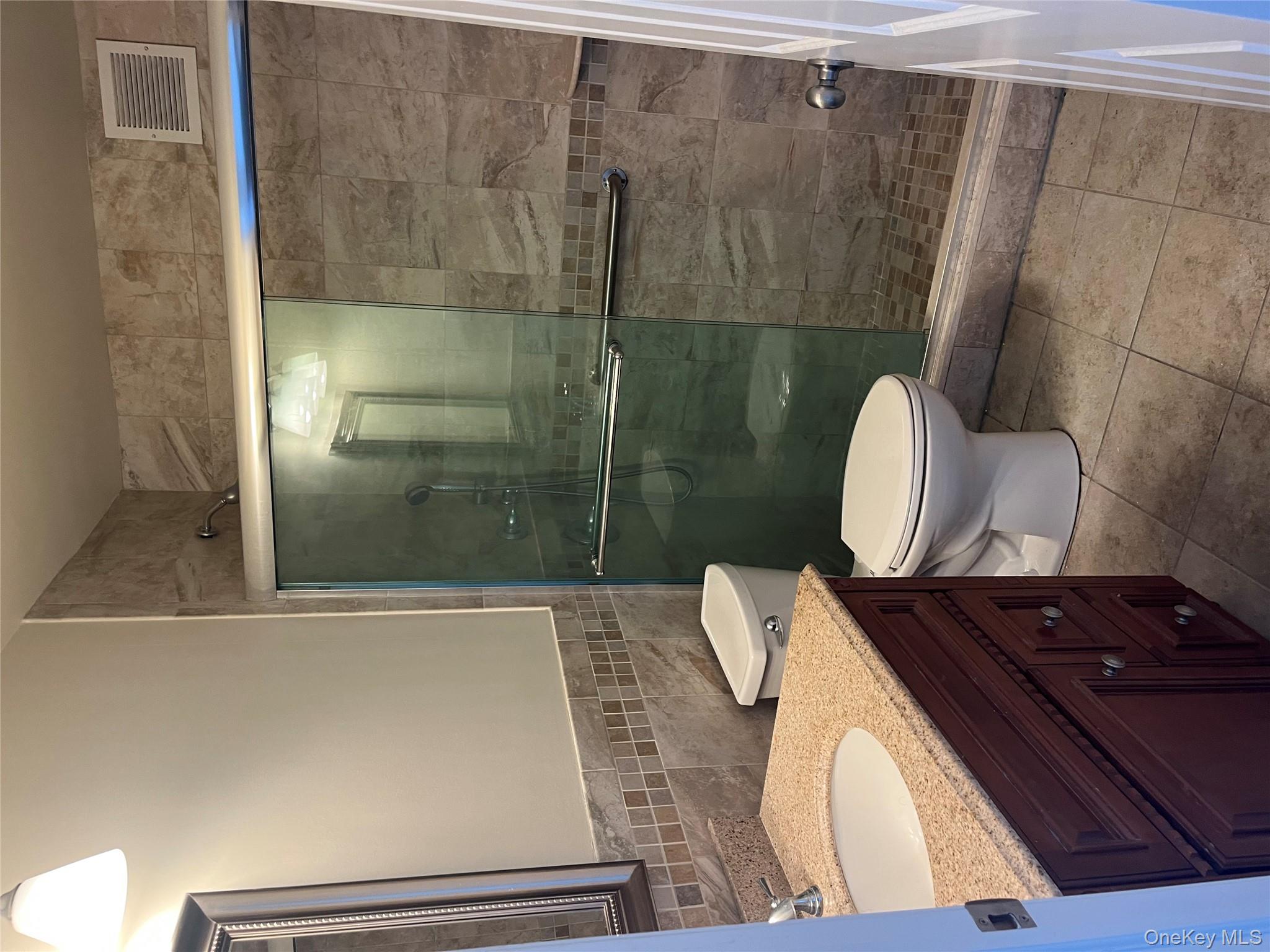 2 Bay Club Drive, Unit 6D Queens, NY 11360 - Photo 3 of 17 a bathroom with a sink and a toilet