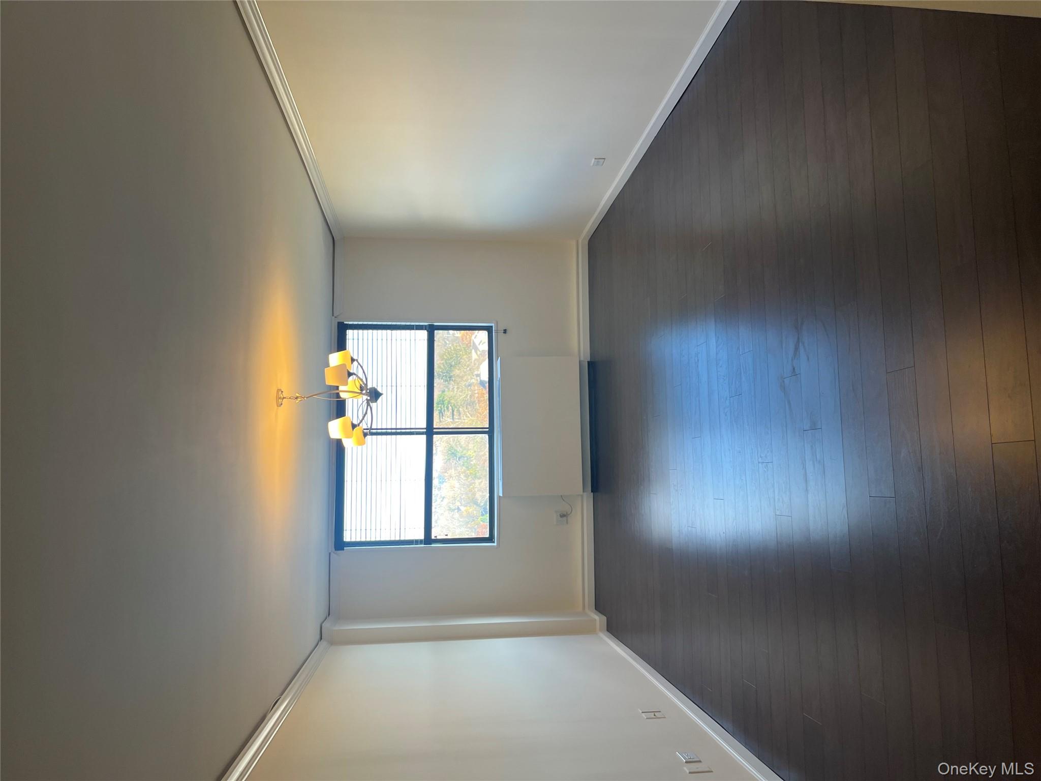 2 Bay Club Drive, Unit 6D Queens, NY 11360 - Photo 5 of 17 an empty room with a window