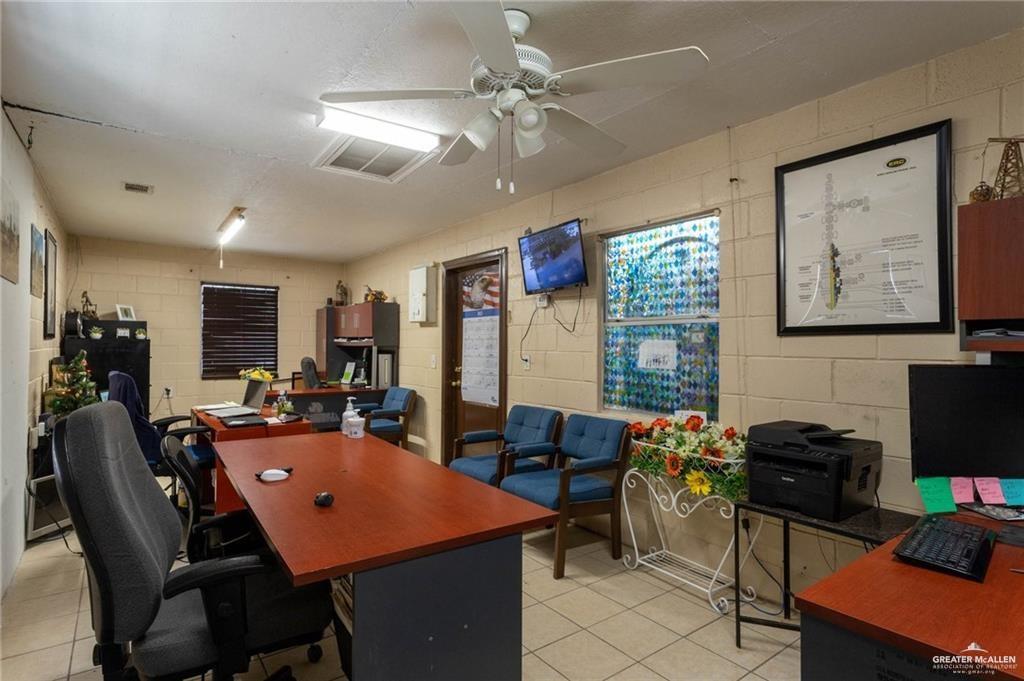 6470 North Moorefield Road Mission, TX 78573 - Photo 8 of 25 a dining room with furniture a chandelier fan and a window