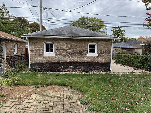 2309 Ridgeland Avenue Berwyn, IL 60402 - Photo 15 of 15 a brick house with a yard