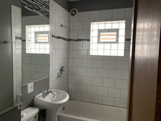 2309 Ridgeland Avenue Berwyn, IL 60402 - Photo 8 of 15 a bathroom with a sink a toilet and shower