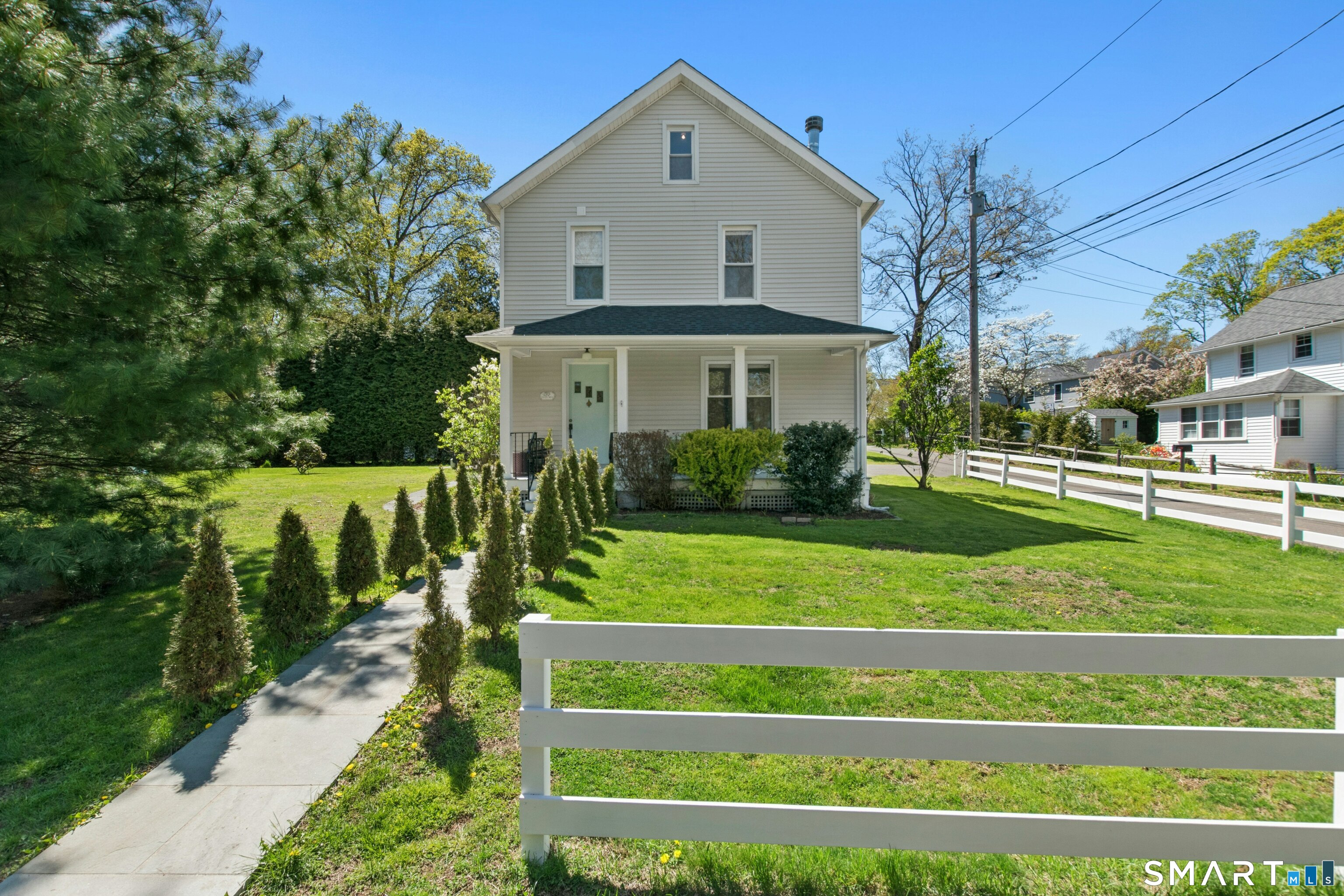 180 Oxford Road Fairfield, CT 06890 - Photo 1 of 1 a front view of a house with a yard