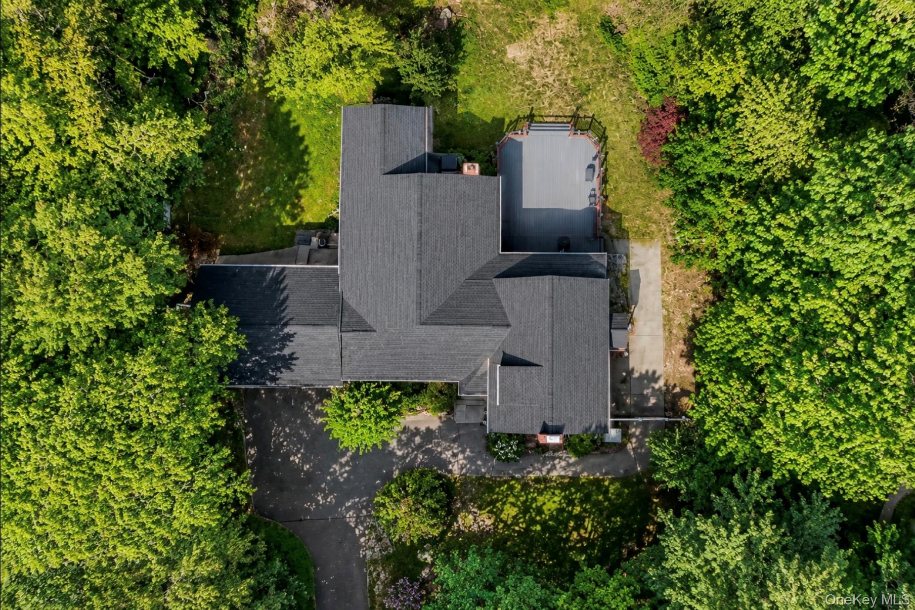 80 Mt Pleasant Road Smithtown, NY 11787 - Photo 26 of 27 an aerial view of a house with a yard and trees all around