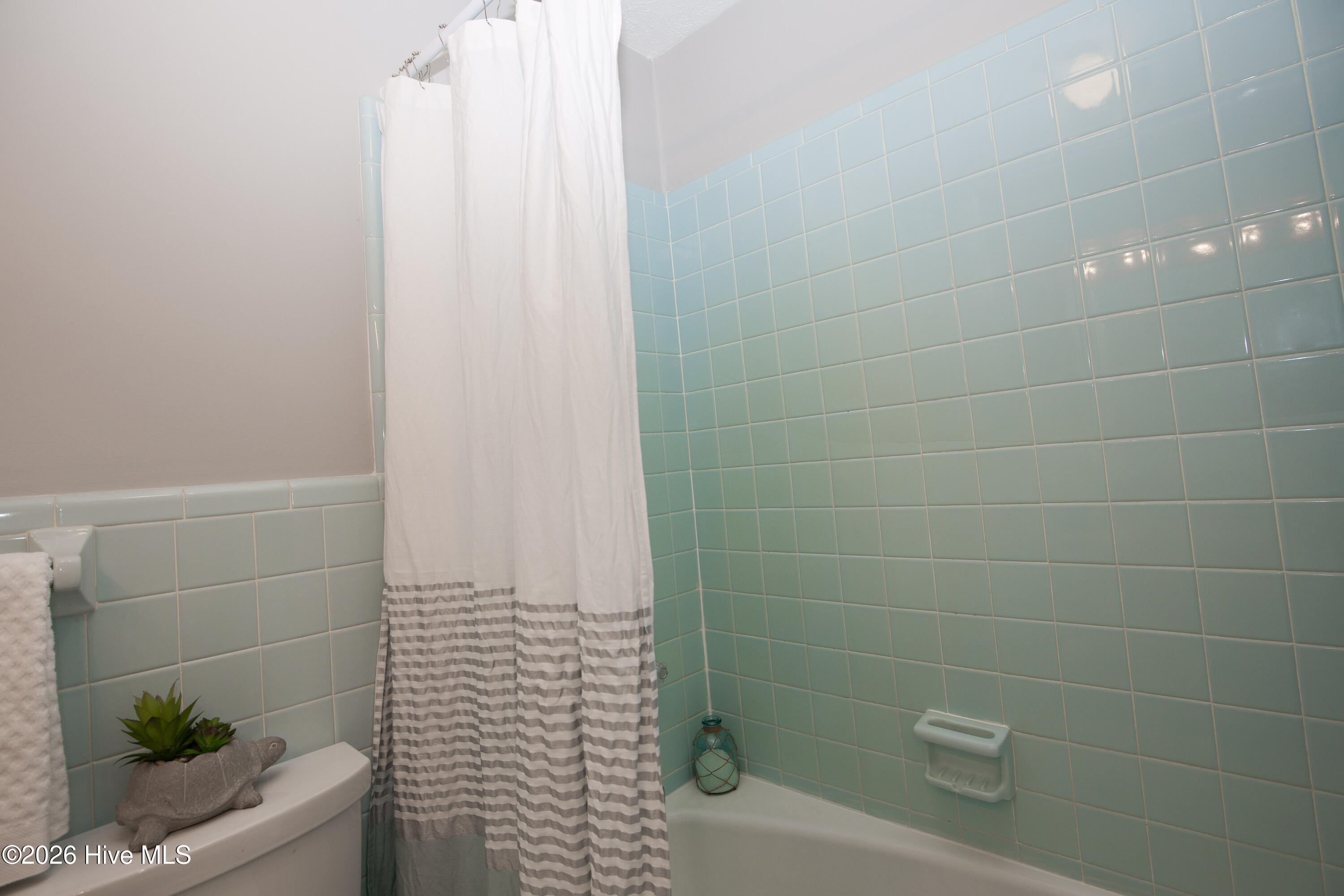 5068 Lobelia Road Vass, NC 28394 - Photo 49 of 70 Classic tile surround and built-in soap dish offer vintage charm in this well-maintained shower/tub combo.