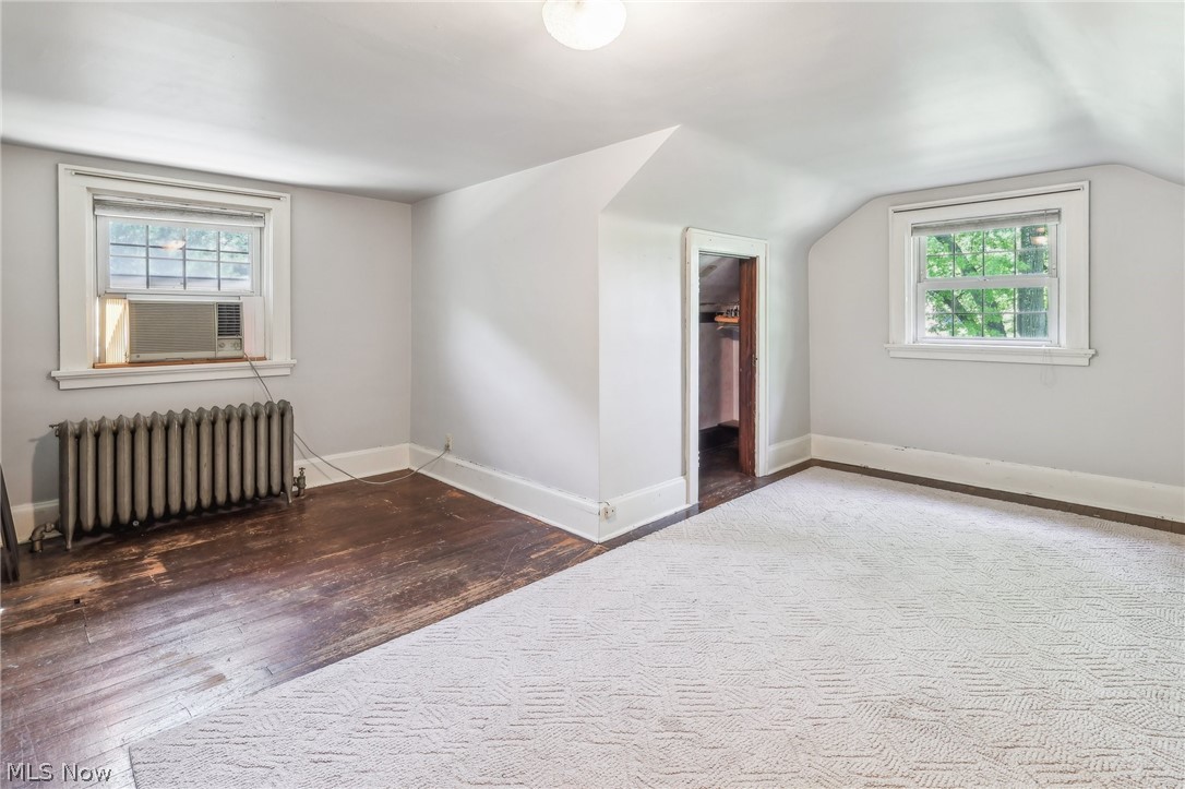 2329 Stillman Road Cleveland, OH 44118 - Photo 42 of 49 Additional living space featuring hardwood / wood-style flooring, radiator heating unit, and vaulted ceiling