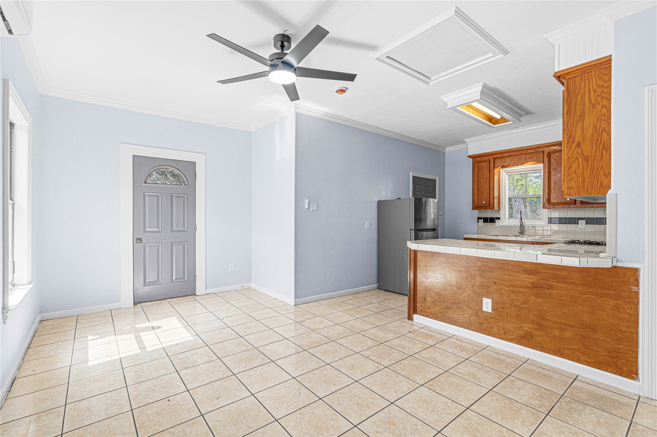 7839 Goode Street, Unit B Houston, TX 77012 - Photo 5 of 11 a view of a kitchen with a sink and a refrigerator