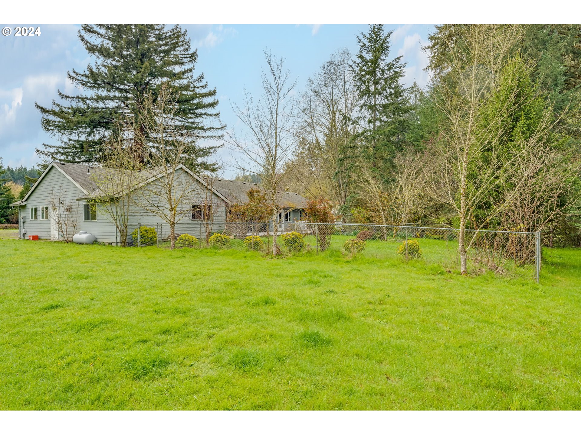16583 Southwest Midway Road Hillsboro, OR 97123 - Photo 40 of 48 a view of a house with a yard