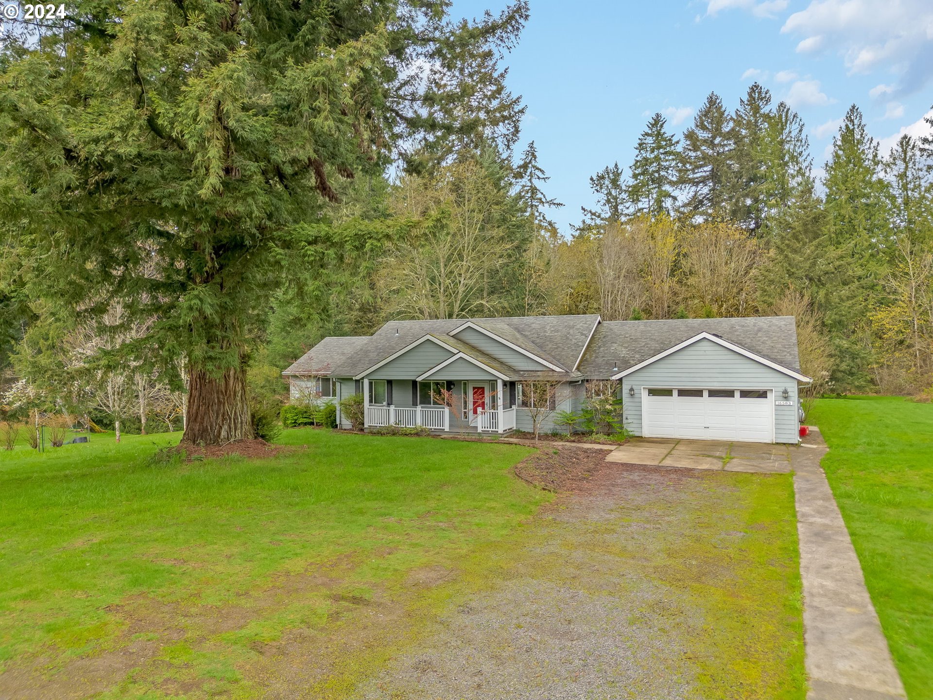 16583 Southwest Midway Road Hillsboro, OR 97123 - Photo 4 of 48 a front view of a house with garden