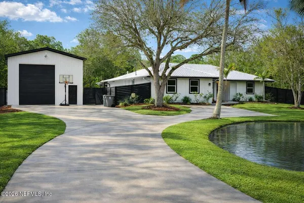 a swimming pool with outdoor seating and yard