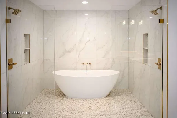 a view of a bathtub in a bathroom