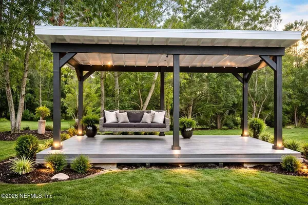 a wooden bench sitting in front of a building